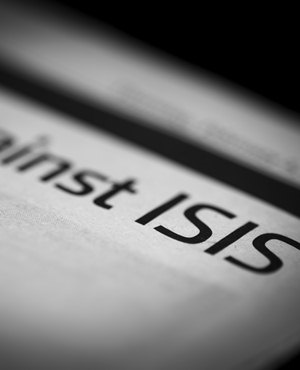 ISIS written newspaper, shallow dof, real newspaper.